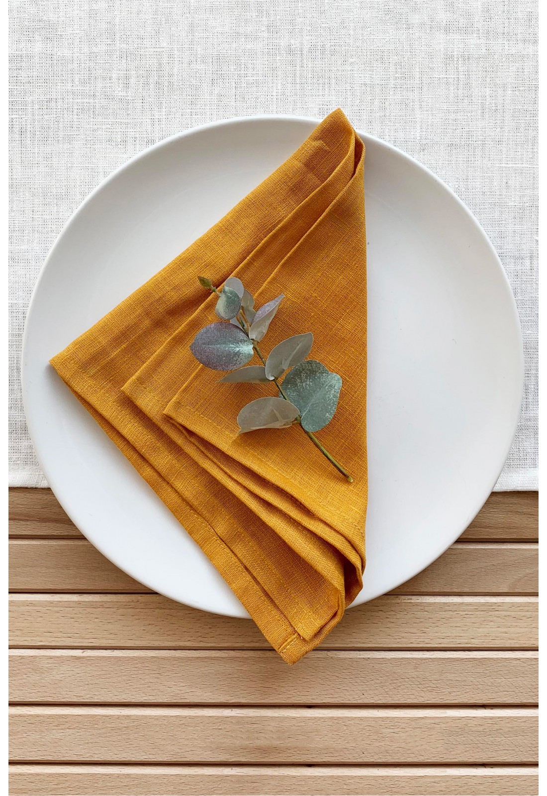 https://www.touchablelinen.com/image/cache/catalog/products/22/Linen-napkins-in-mustard-yellow-7-1100x1600.jpg